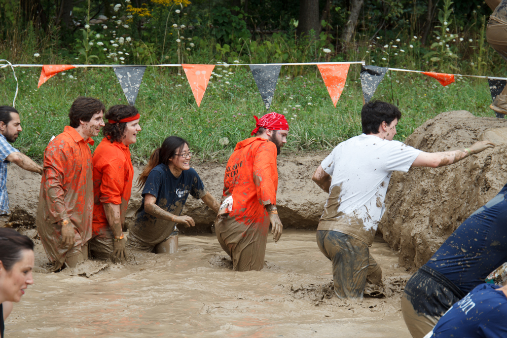 Interns Evan and Esther competing in Tough Mudder